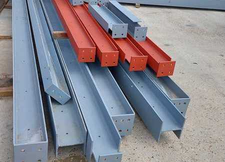 Primed and painted beams ready for delivery