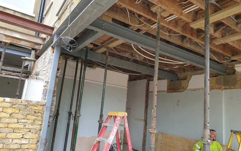 Extension steels in, walls propped
