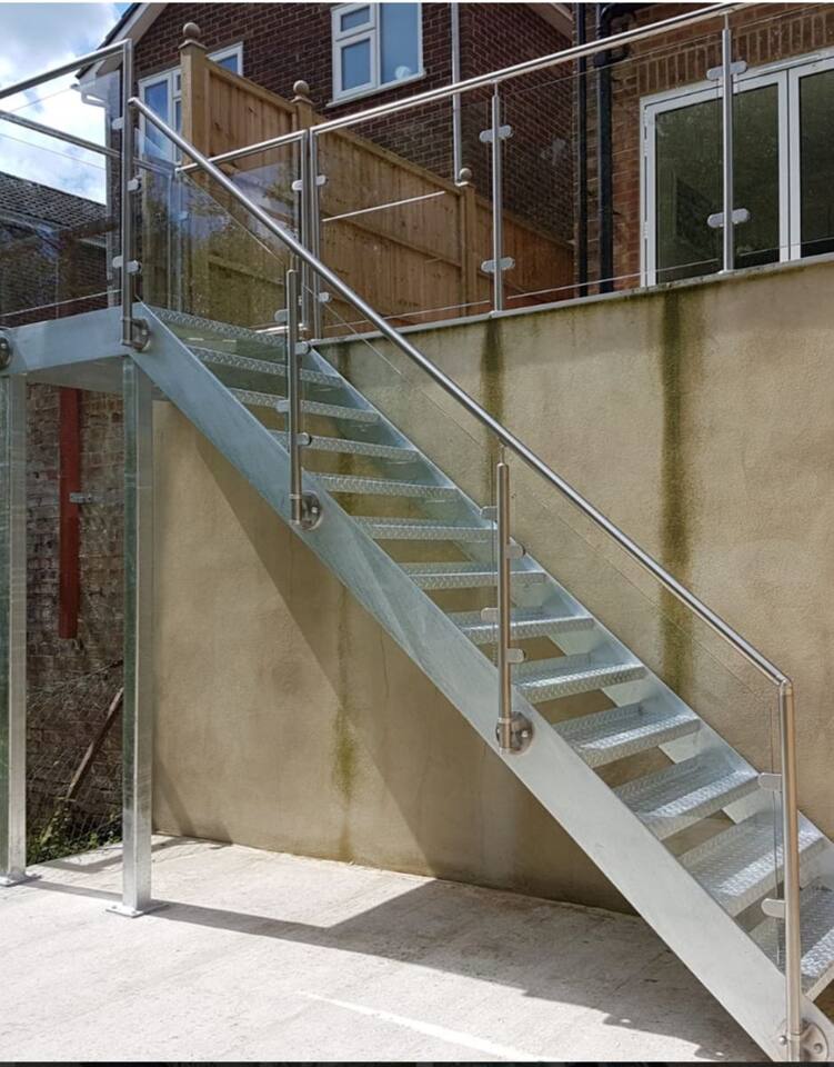 Galvanised external stair with a glass balustrade